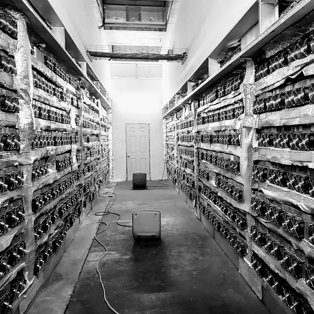 Hosting aisle lined with ASIC miners